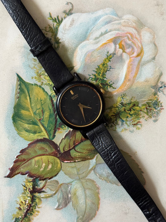 working gold tone black leather seiko watch
