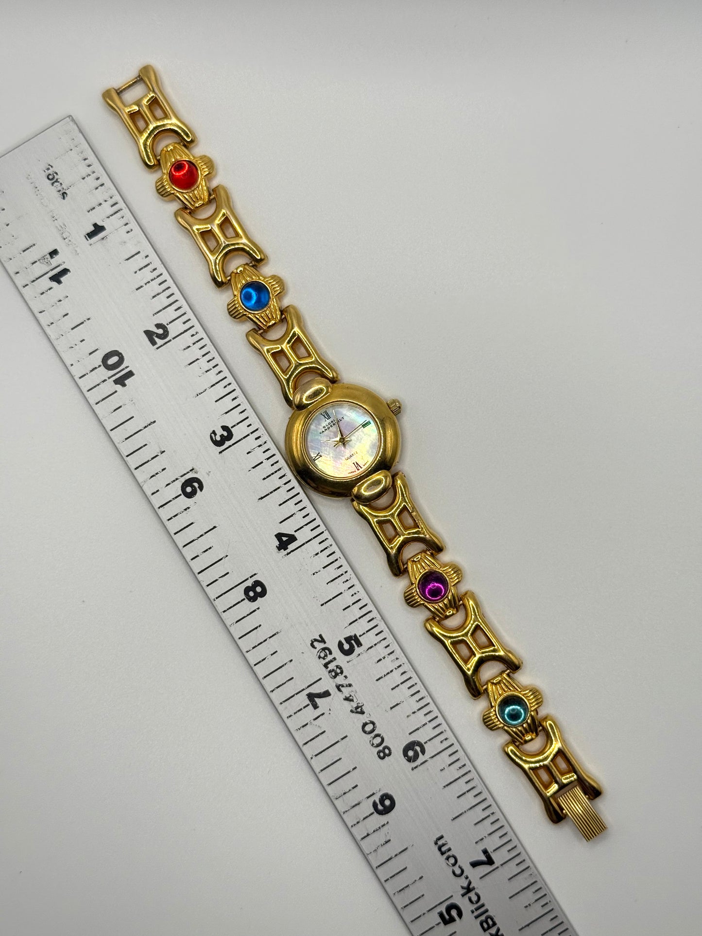 working gold tone gemstone watch