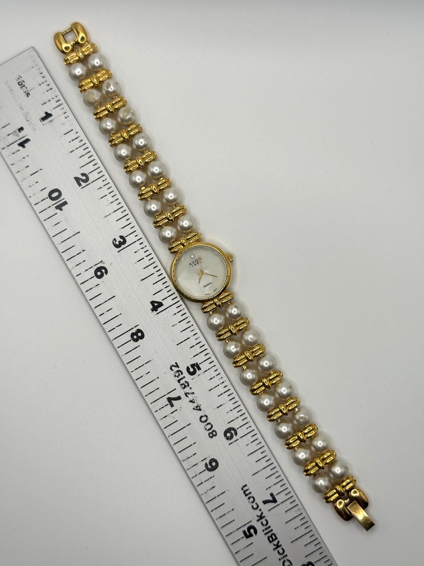 nonworking gold tone pearl band watch