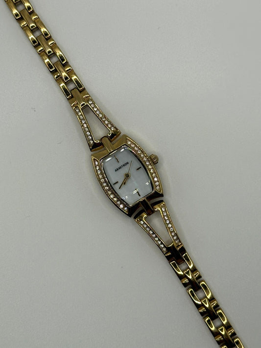 working gold tone crystal bezel watch