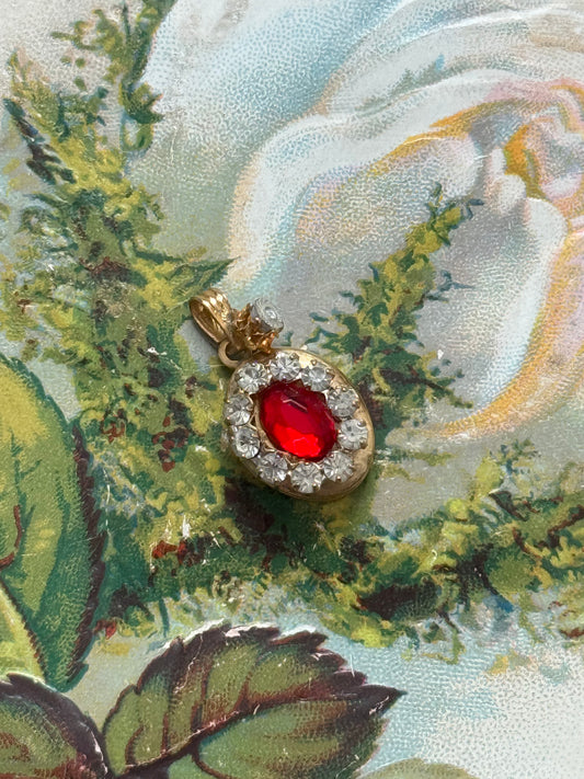 gold tone red gemstone locket pendant