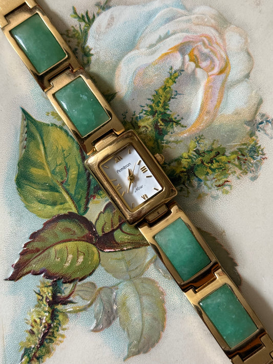working gold tone green gemstone watch