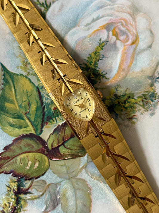 nonworking gold tone heart bezel watch