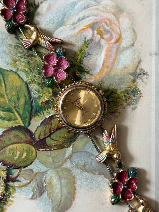 untested gold tone hummingbird slide charm watch