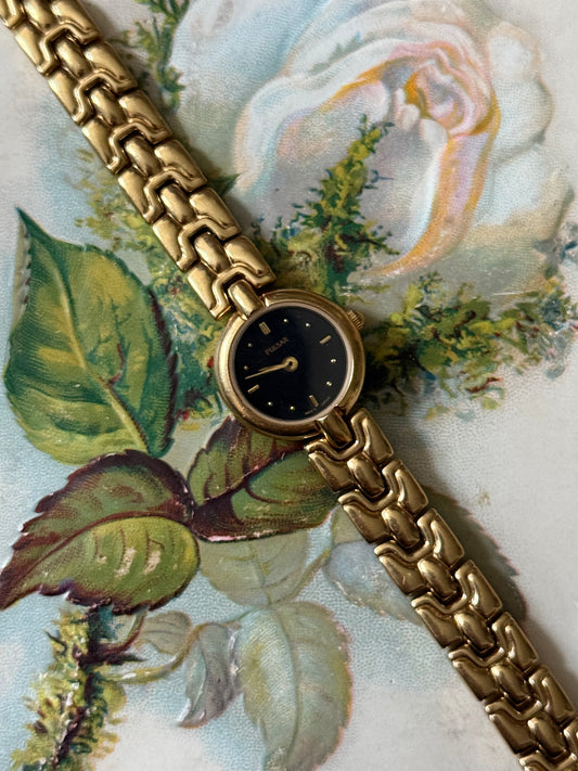 working gold tone black dial watch