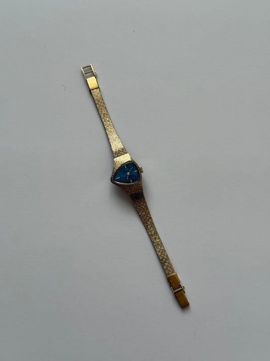 working wind up gold tone dragon’s eye blue dial half moon seiko watch