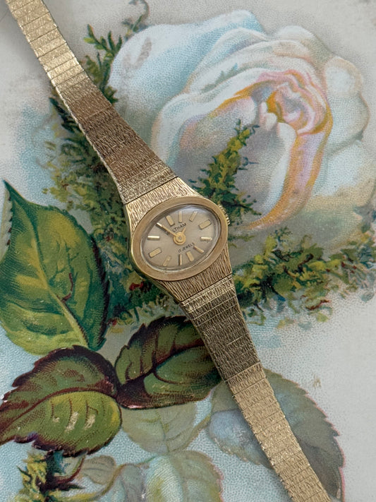 waltham gold tone dainty oval dial watch