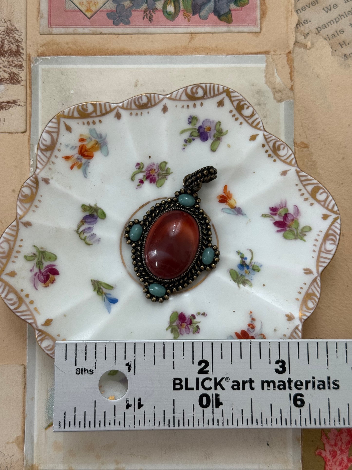 bronze tone (?) gemstone pendant