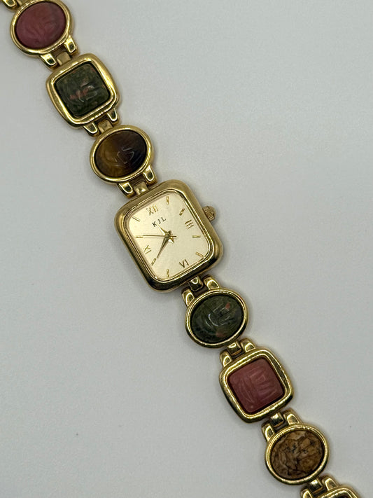working gold tone Kenneth Jay Lane mauve scarab watch