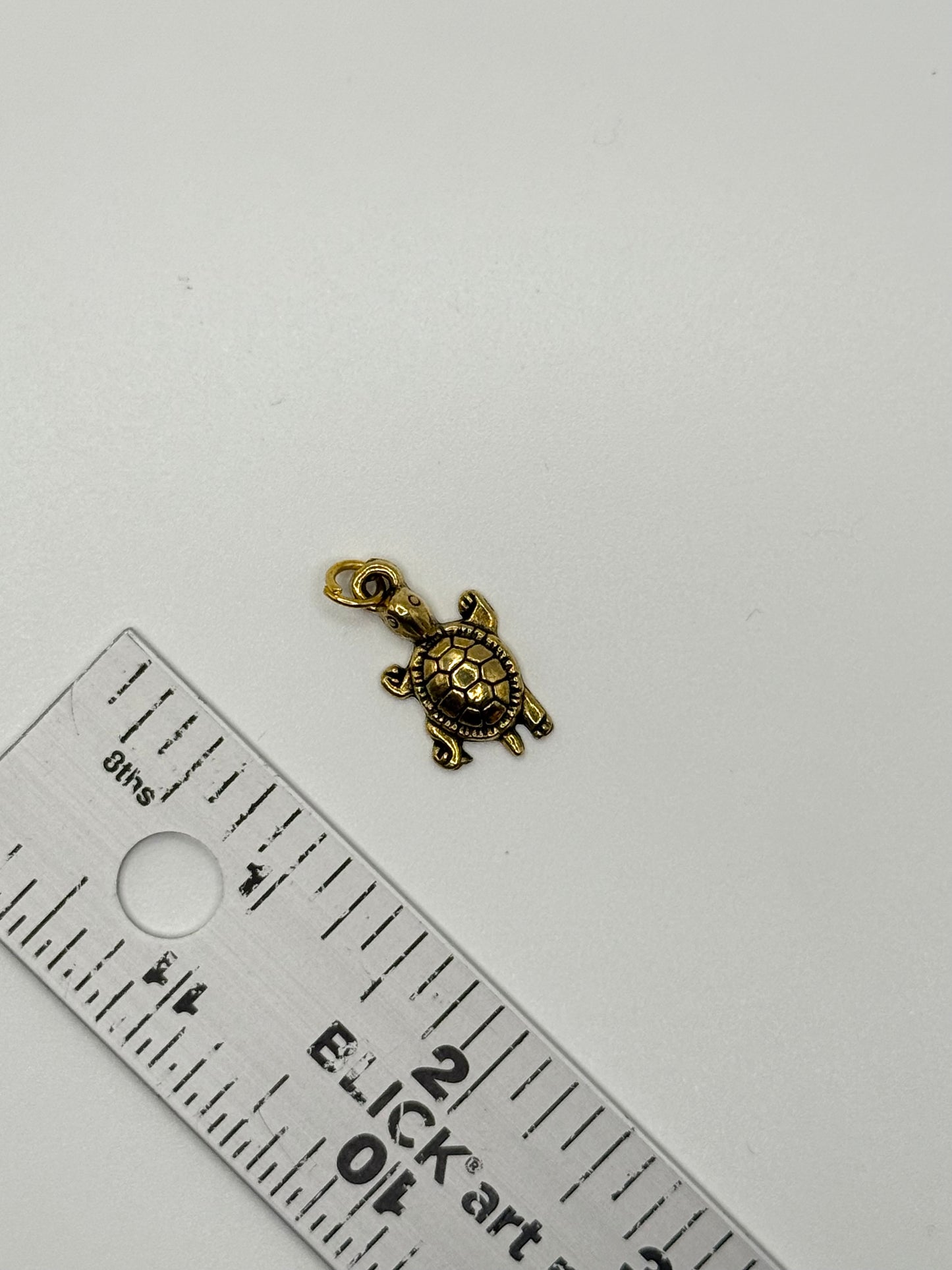 gold tone turtle pendant