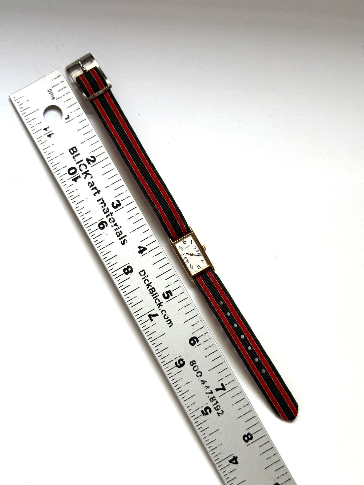 working gold tone red and green strap seiko watch